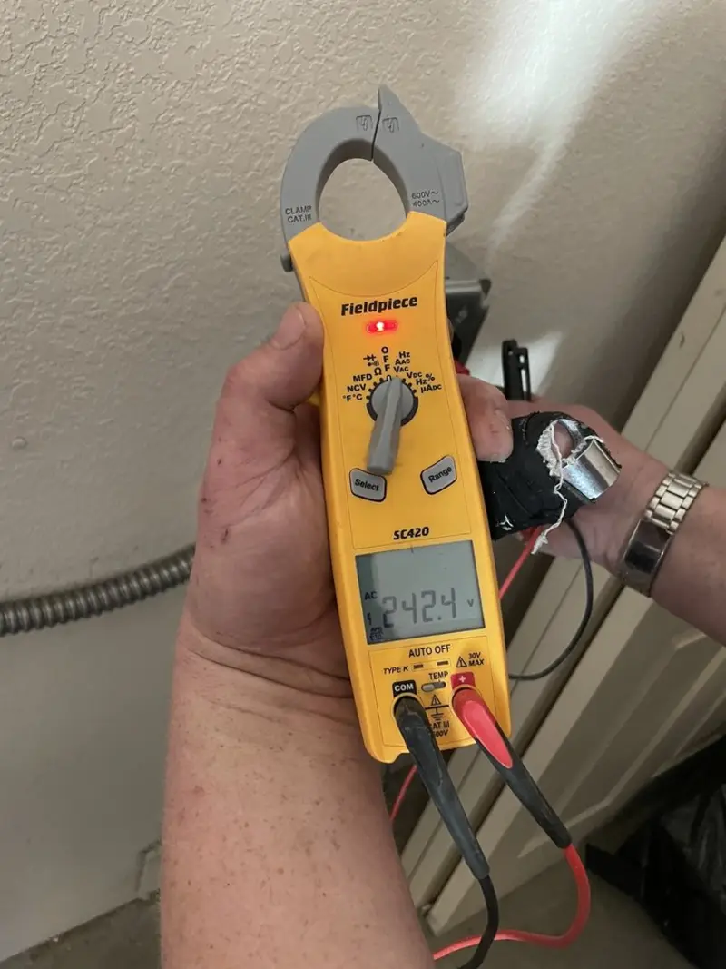 Voltage testing with clamp meter during Recessed Lighting Installation in Fair Lawn